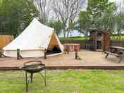 Bell tent with hot tub, picnic bench, firepit and campers' kitchen