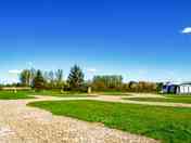 Electric hardstanding and grass touring pitch