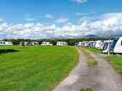 Site and pitches with a mountain backdrop
