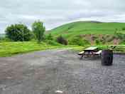 Hardstanding with picnic tables by the cider barn