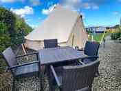 Bell tent with outdoor seating area