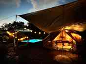 Bell tent lit up at night