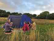 Visitors enjoying an evening on one of our tent pitches