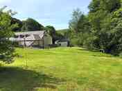 Grass pitches along Ashcombe water
