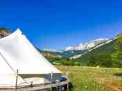 Bell tent set against a blue sky