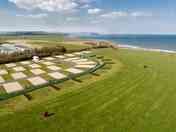 Aerial view of the main tent field and super pitches for touring caravans