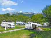 Level grass pitches with mountain views