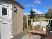 Exterior of our Shepherds Hut with raised deck and seating area (added by manager 03 Jul 2022)