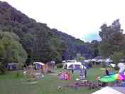 The field with the campfire circle and the playground