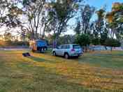 Camping area along the tree-lined river