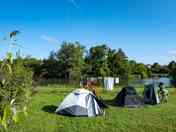 Grass pitches by the river
