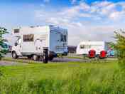 Electric gravel touring pitch, with grass around the pitches (added by manager 22 Jul 2022)