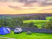 Grass pitches with views of the countryside
