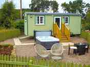 Exterior of the shepherd's hut showing hot tub