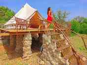Bell tent raised on pillars