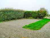 Gravel Hardstanding Pitch with electric, water and grey waste drainage. Parking available nearby.