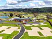 Drone view of the touring park and looking towards Arthur's Restaurant & Bar