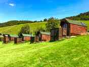 Pods with a hilly backdrop