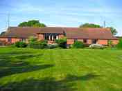 A beautifully-furnished, single-storey barn divided into holiday cottages