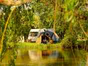 Pitches tucked away by the river