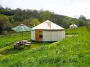 Yurt and family yurt tucked into the hill