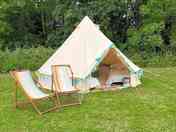 Belle tent surrounded by greenery