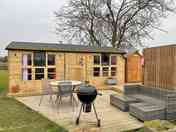 Outside area with a barbecue and fire pit