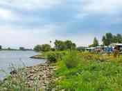By the water