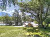 Pitch between the river and trees