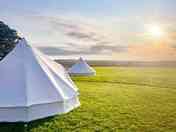 Sunset behind the bell tents