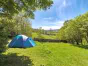 Grass pitch with rural surroundings