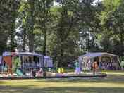 Pitch your tent around the play area