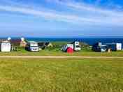 Top of the field on the outer edges with views of the Irish Sea