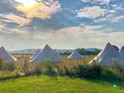 Glamping tents in the morning sun