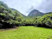 Grassy pitches with mountain views