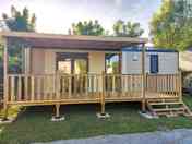 Partially covered terrace with wooden table and chairs (added by manager 15 Mar 2024)