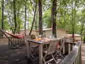 Decking with seating and a hammock outside of the safari tent (added by manager 11 Jul 2023)