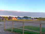 Outside the toilet block. Hard standing pitches on the right & tent pitches the other side of fence (added by visitor 07 Jun 2021)