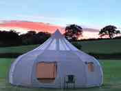 Beautiful sunset at camp site , stargazer tent