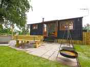 Patio with a woodfired hot tub and barbecue