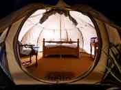 Luxury glamping bell tents, furnished with a comfortable double bed and various cosy amenities