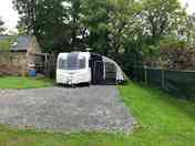 Space for caravan and awning with parking in front