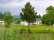 View of the tent area from the far side of the pond (added by manager 11 Aug 2022)