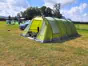Our pitch with car next to car. 7.4m x 3.6m tent with hook up (added by visitor 18 Aug 2021)
