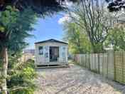 The Retreat with patio doors opening West from the living space & a secure parking and garden area