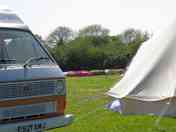 VW camper in campsite field