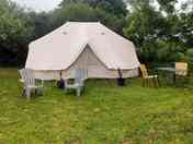 Bell tent with outdoor chairs