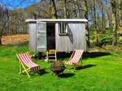 Deckchairs and barbecue by the hut