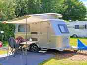 Lovely Retro Caravan sitting on one of our bark caravan pitches