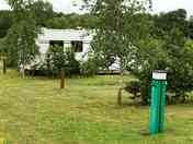 Serviced pitch surrounded by greenery